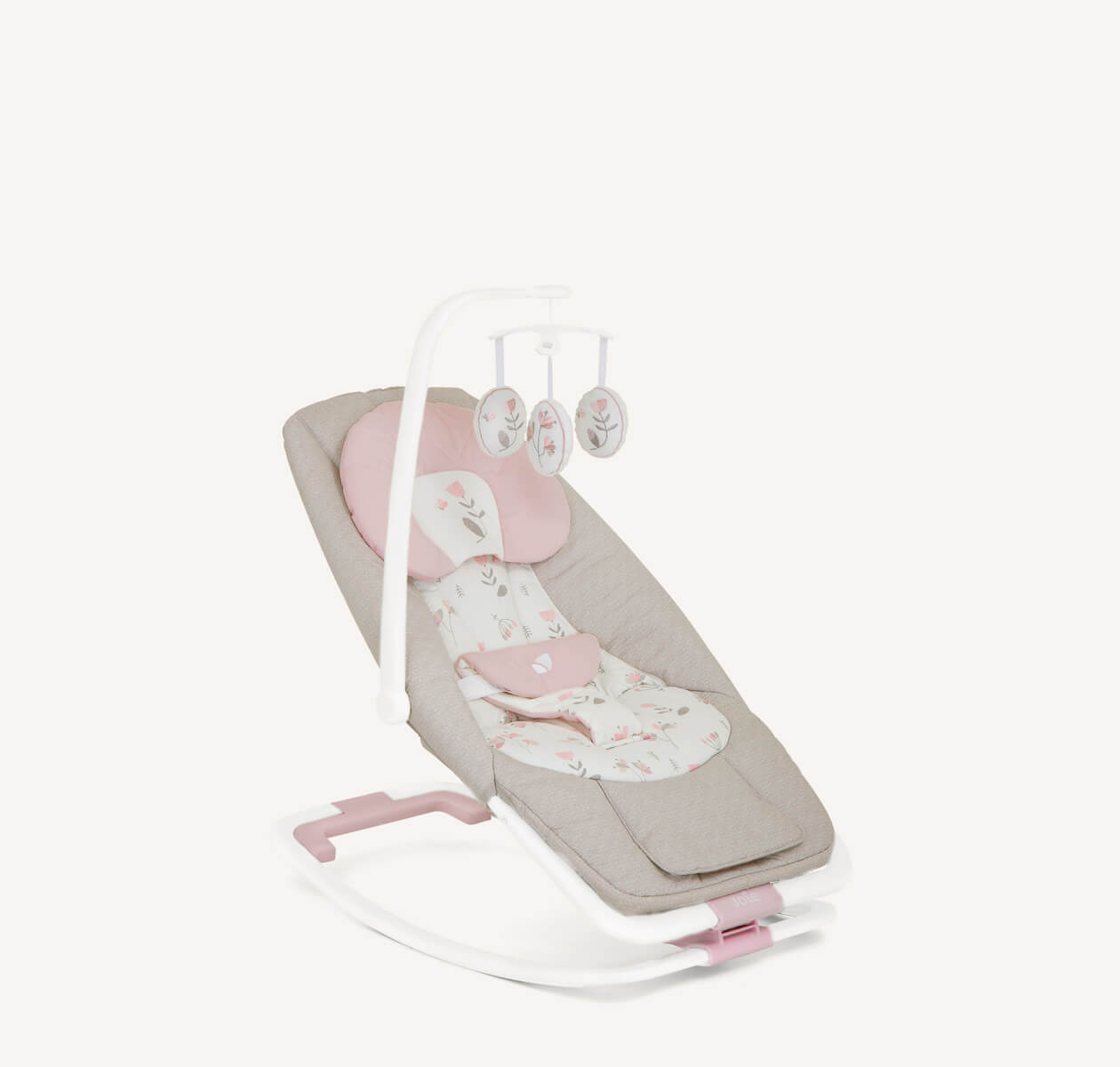 Pink and grey flower-patterned dreamer Joie bouncer positioned at a right angle.