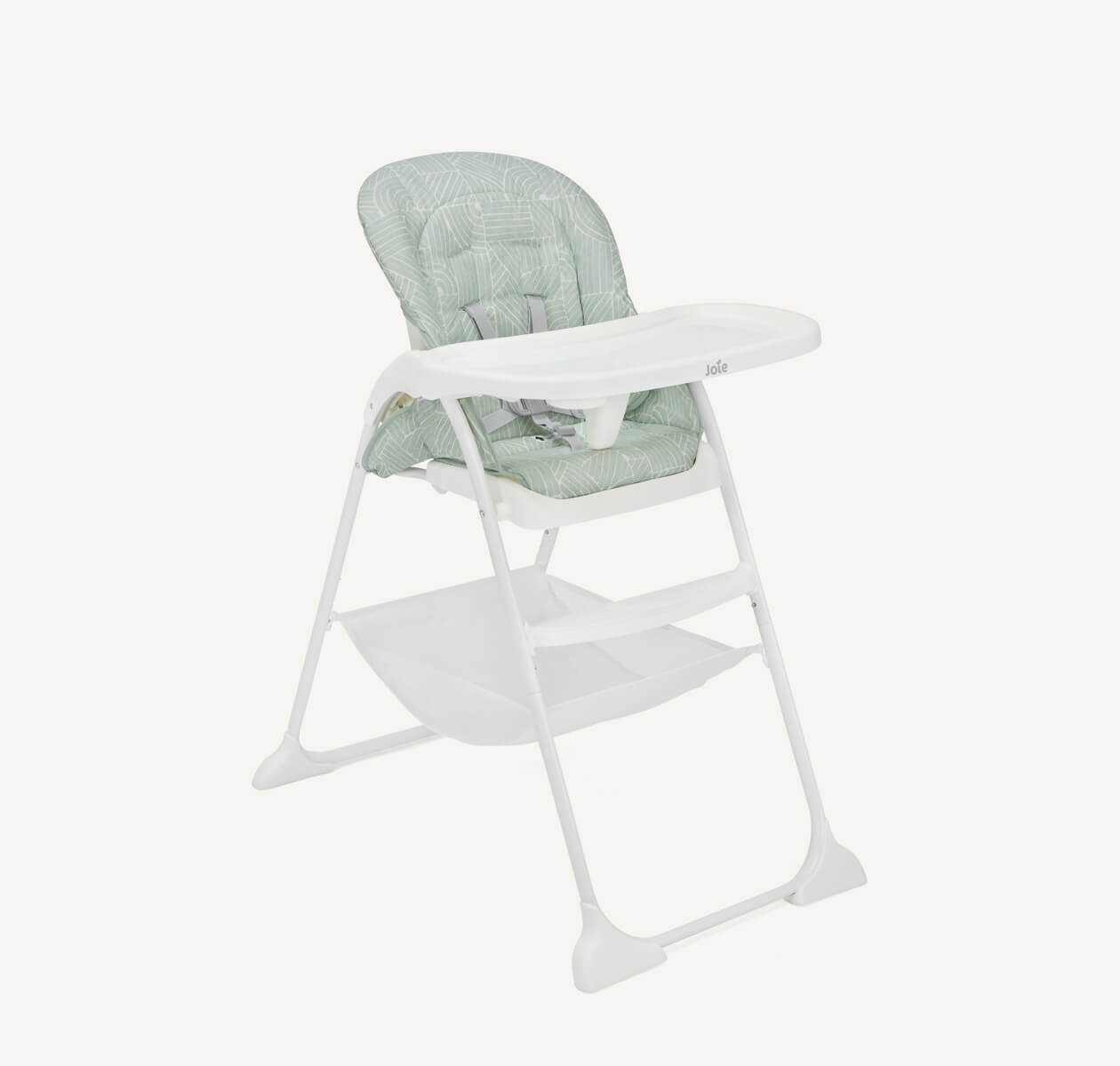 Joie Mimzy Snacker highchair with a white frame and a light green seat pad facing at a right angle.