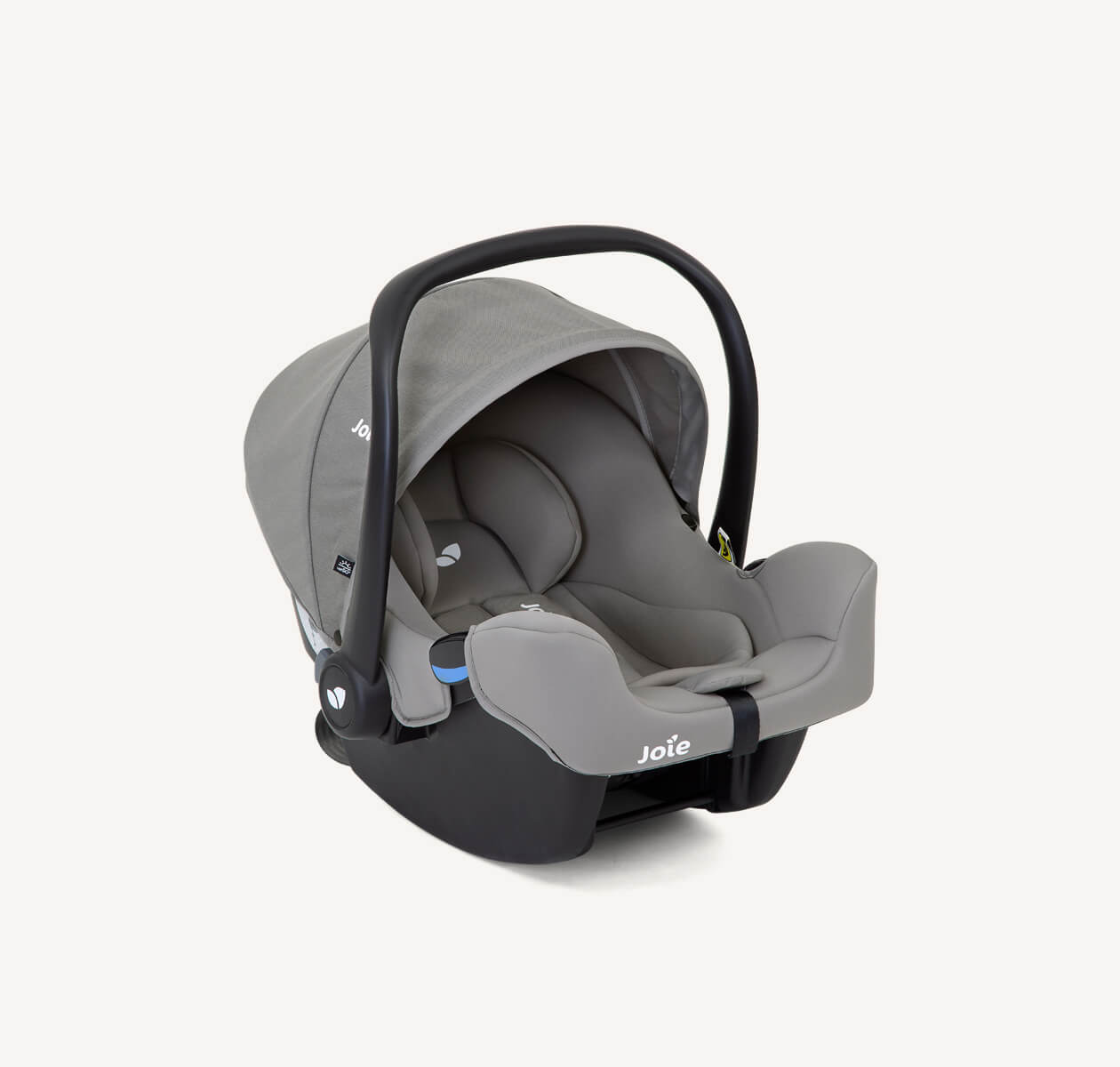 Joie I-snug infant car seat in a grey colour with canopy and handle up on a right-angle position.
