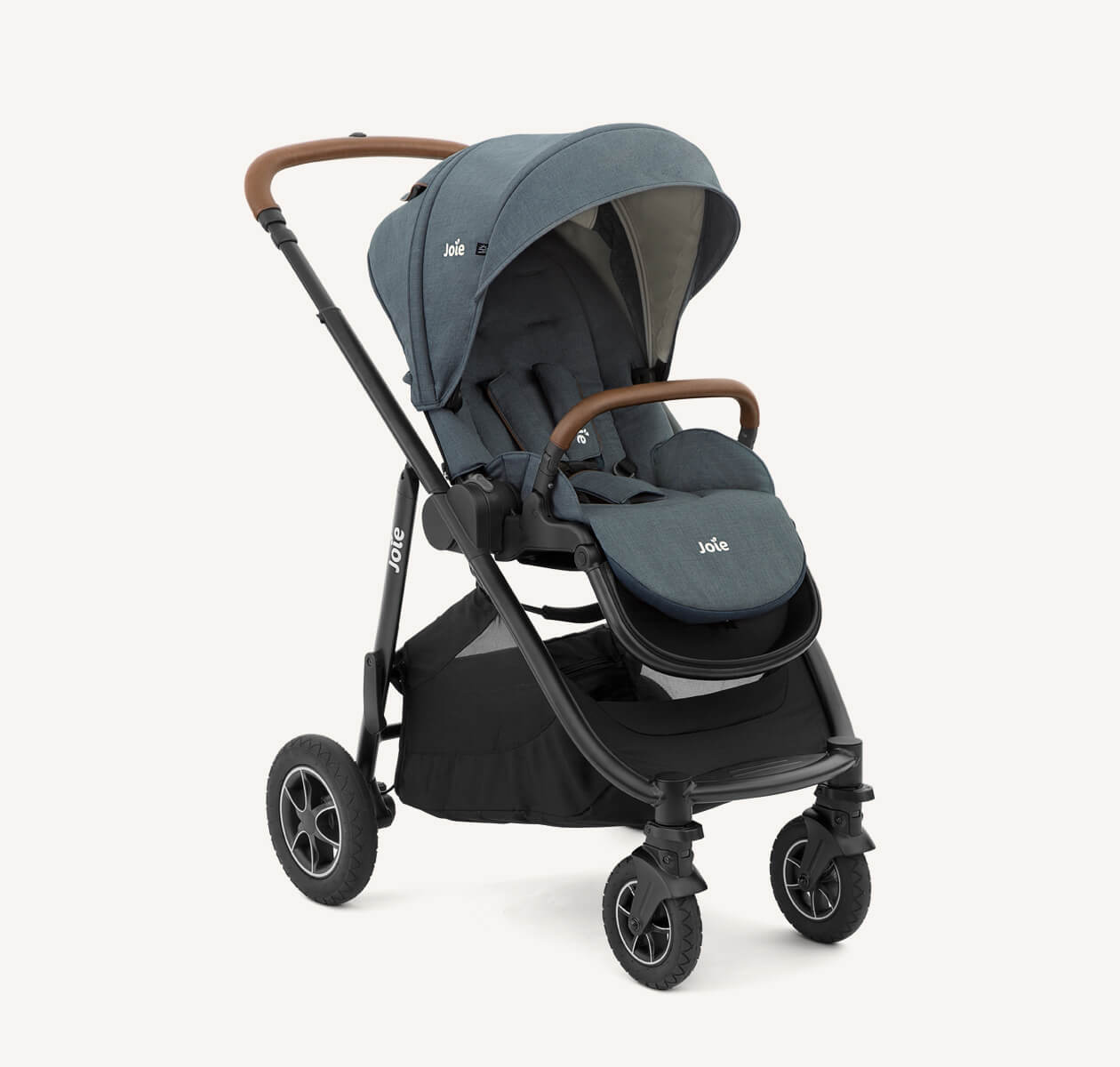 Joie light green versatrax pram positioned at a right angle.

