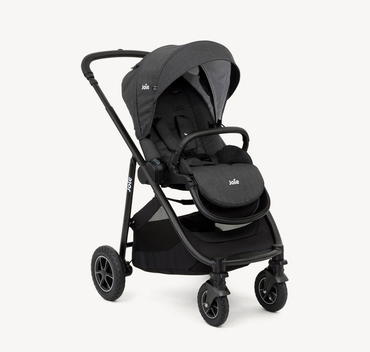 Joie black versatrax pram positioned at a right angle.