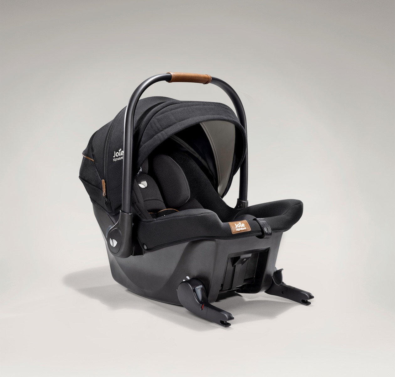 Joie signature's ISOFIX integrated infant carrier in black and black at an angle 
