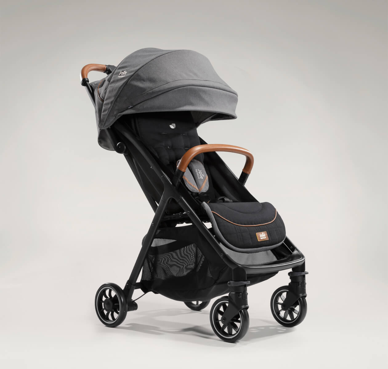 Joie signature lightweight stroller parcel in black and gray at an angle. 