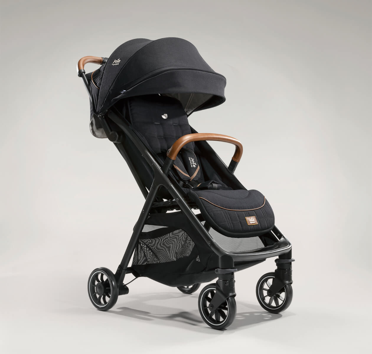    Joie signature lightweight stroller parcel in black at an angle. 