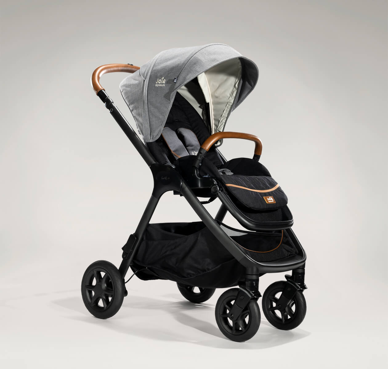 Joie finiti pram in light gray at an angle. 