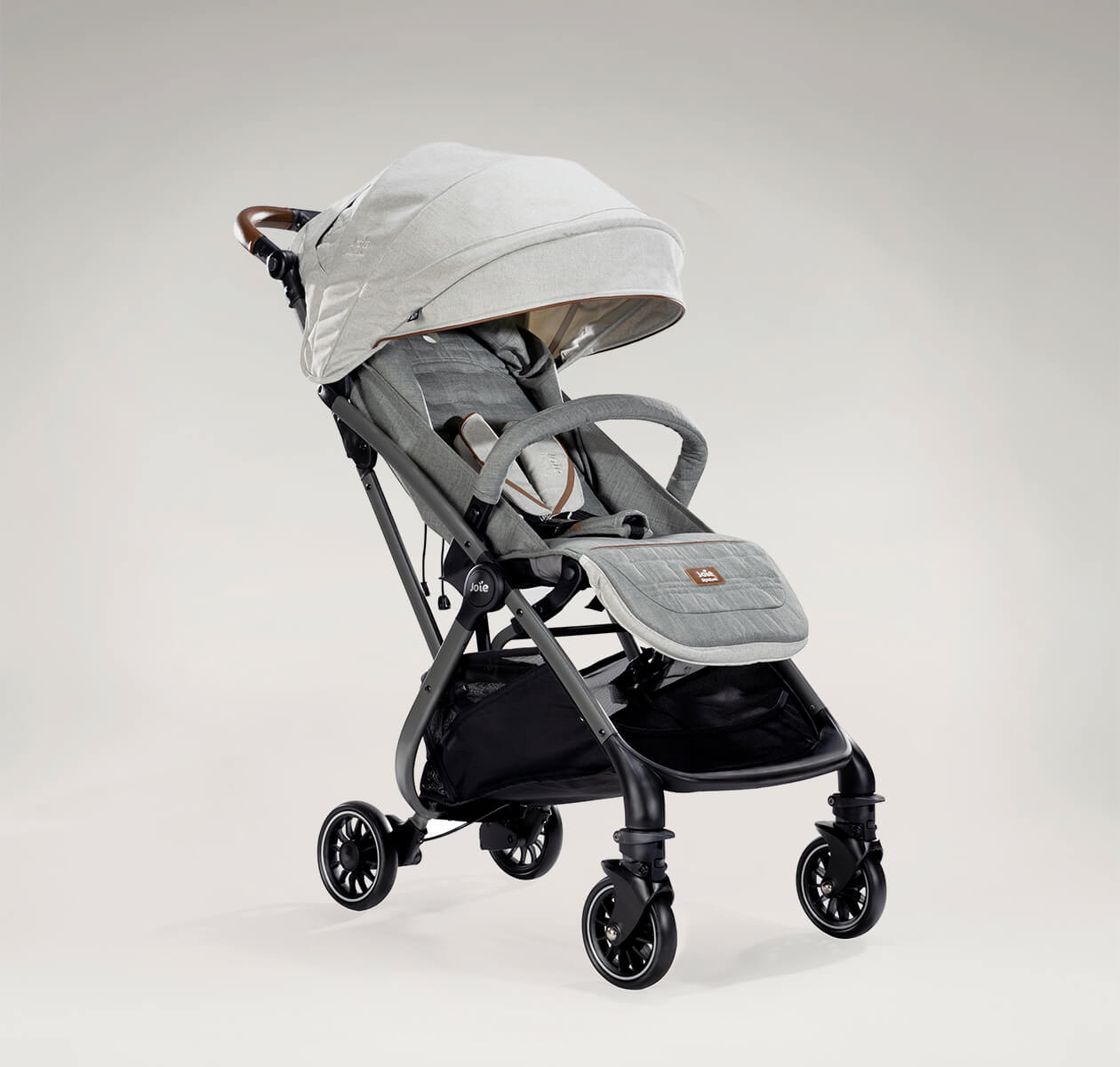 Joie tourist stroller in light gray at an angle.