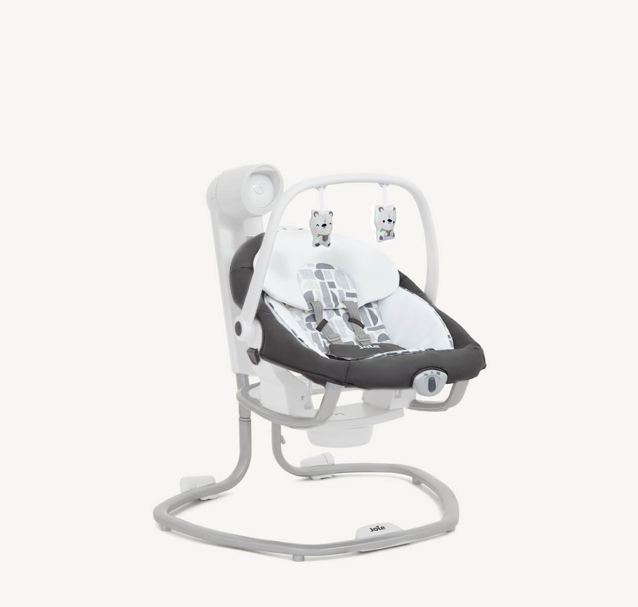 Dark gray and white patterned serina 2in1 Joie swing positioned at a right angle. 