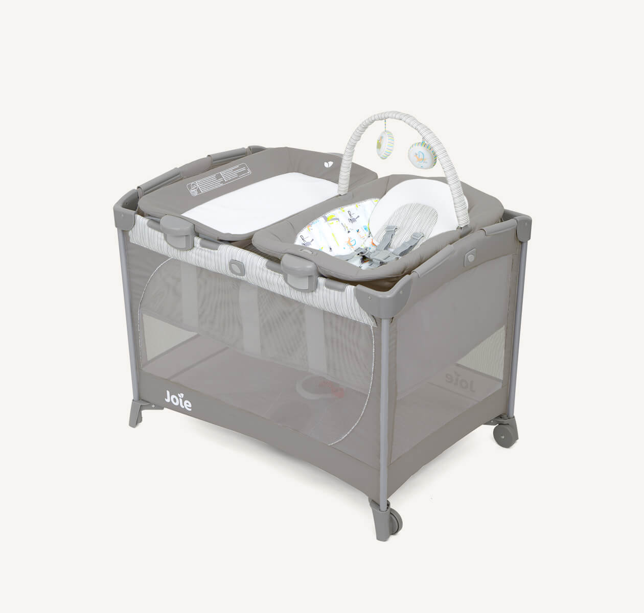 Joie travel cot commuter change & bouncer in grey with bassinet, changer, and bouncer seat at a right angle.