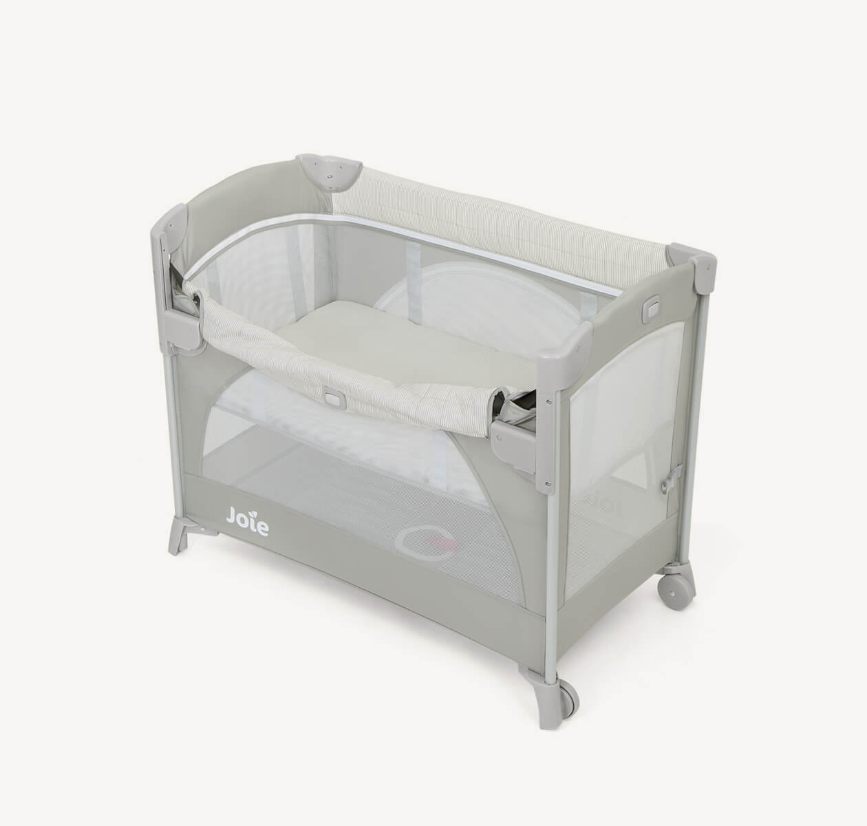 Joie kubbie sleep bedside cot in two-tone gray with drop down side down at an angle.