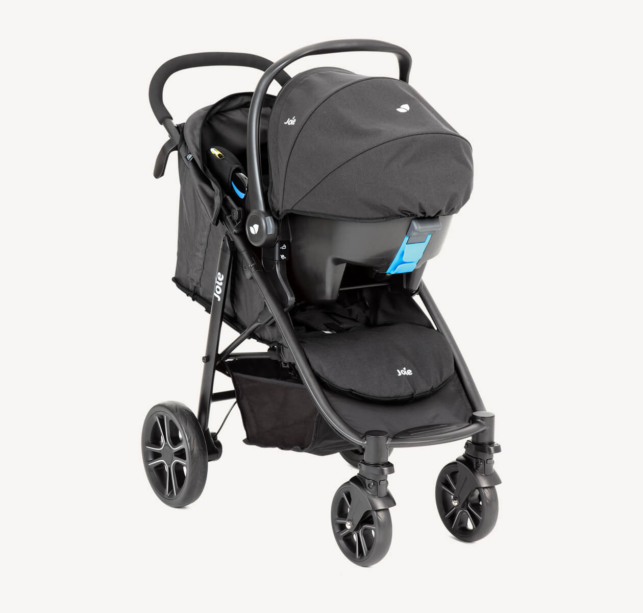Black Joie Litetrax E travel system with the infant car seat attached to the stroller, facing toward the right at an angle.