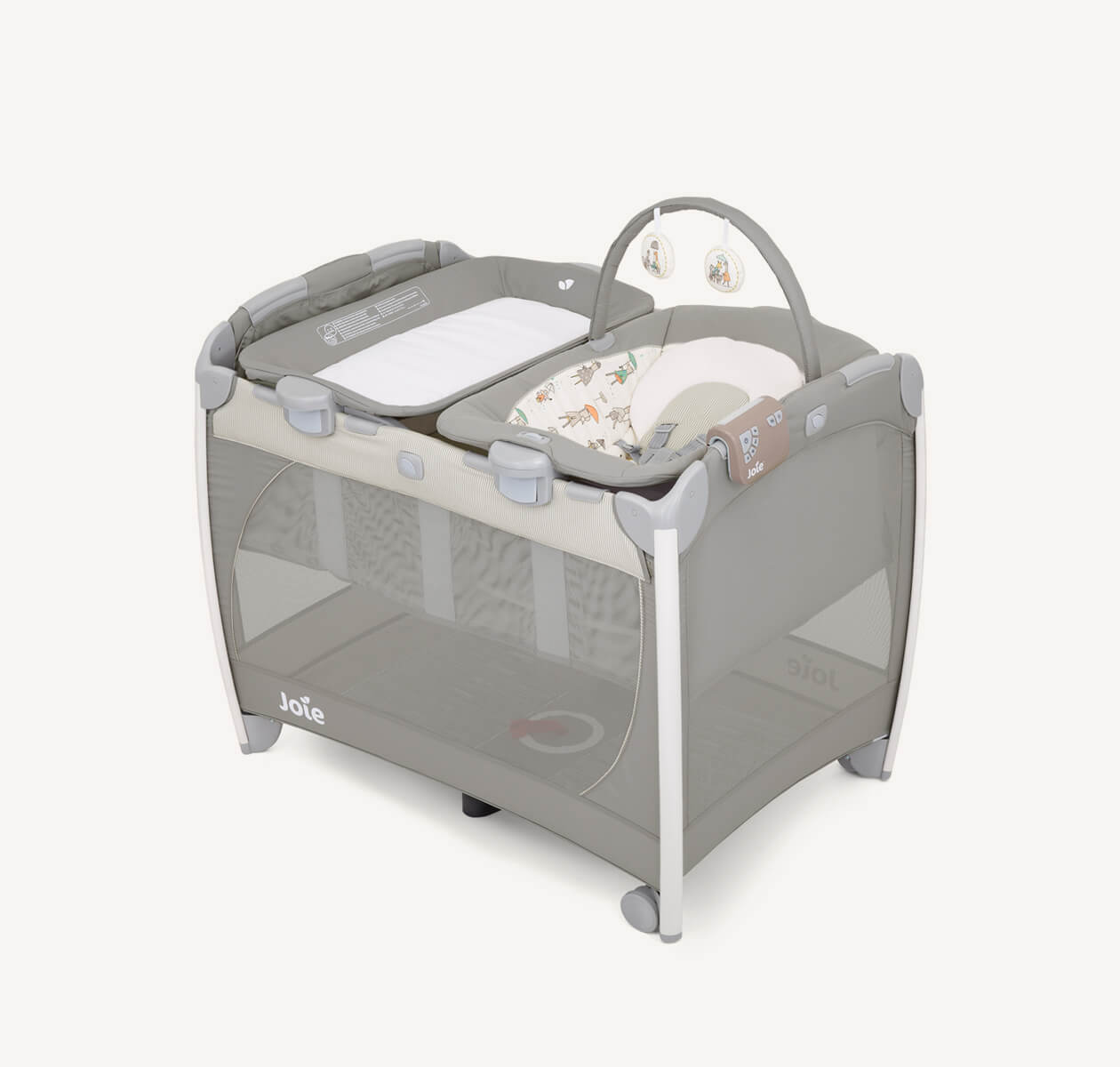 Joie excursion change and bounce travel cot with cartoon imagery at an angle.