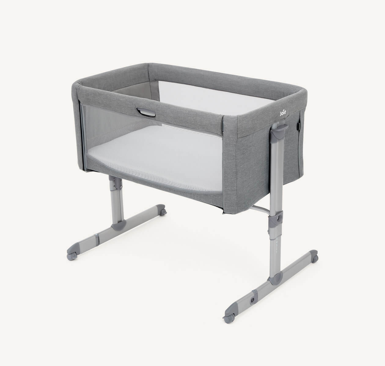   Light gray Joie roomie bedside crib at a right angle.