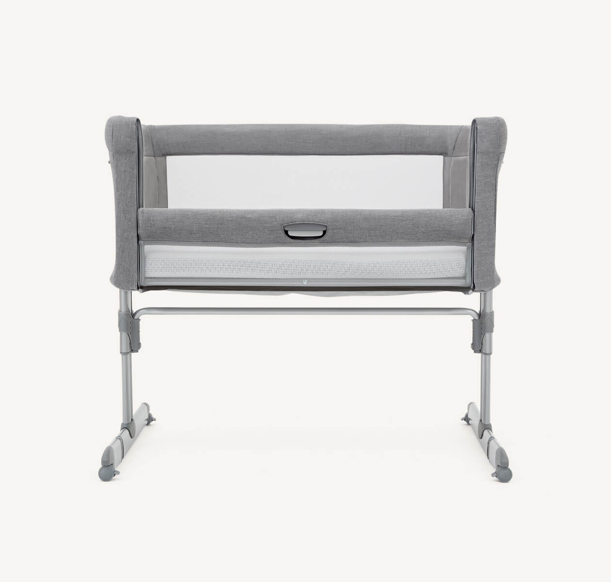  Front view of light gray Joie roomie bedside crib with lift and lower side panel pulled down.