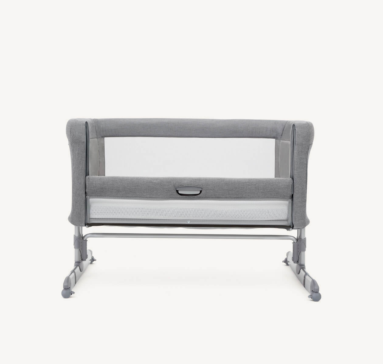   Front view of light gray Joie roomie bedside crib with legs lowered to ground, and lift and lower side panel down.
