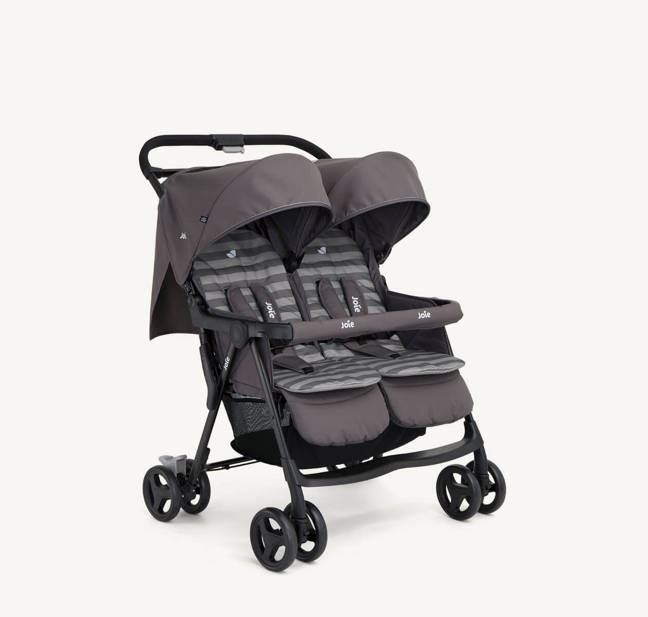  The Joie Aire Twin side-by-side double stroller in dark gray with two tone striped seat inserts, at an angle.