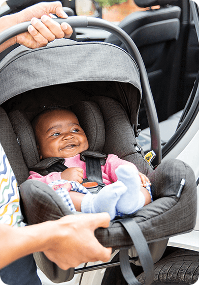 Young infant in the Joie i-Gemm 3 infant carrier car seat