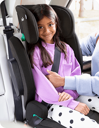 Child in Joie's iTrillo high back booster car seat