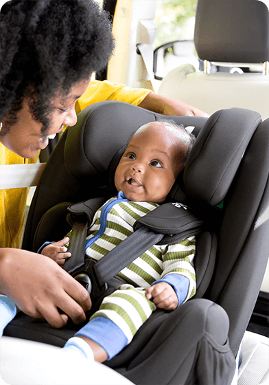 Child in Joie's iTrillo high back booster car seat