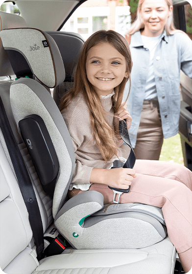 Child in Joie's i-Traver high back booster car seat