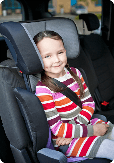 Child in Joie's Trillo high back booster car seat