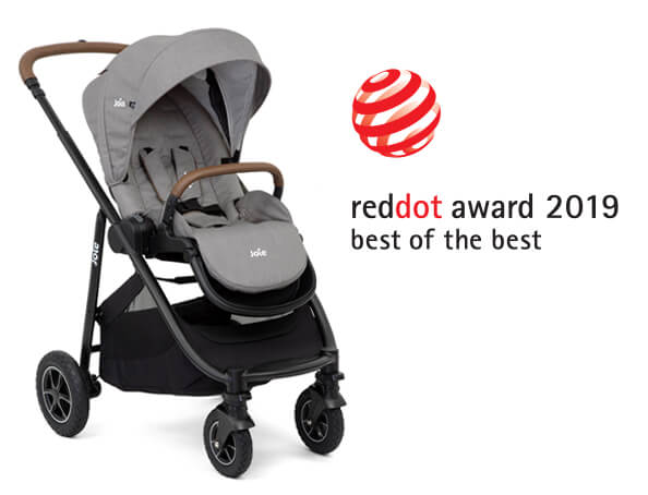 A gray Joie Versatrax stroller at an angle facing to the right, with the Red Dot Design award logo above and to the right.