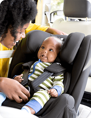 Child in Joie's iTrillo high back booster car seat