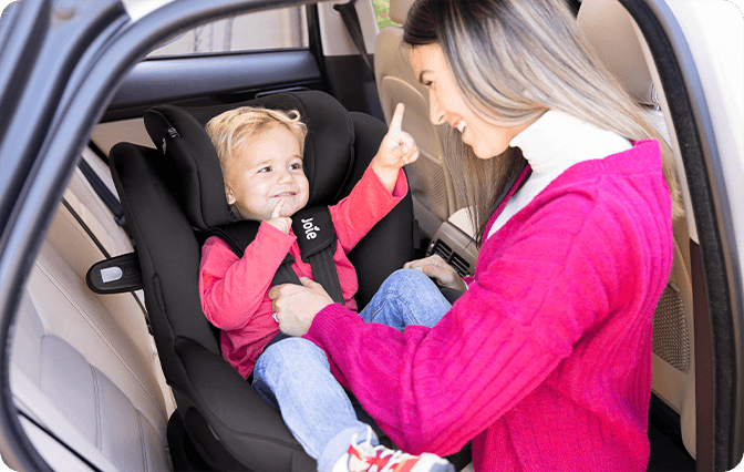 Joie car seat from a side view on a car seat base with a ruler icon to show a good fit on the seat.