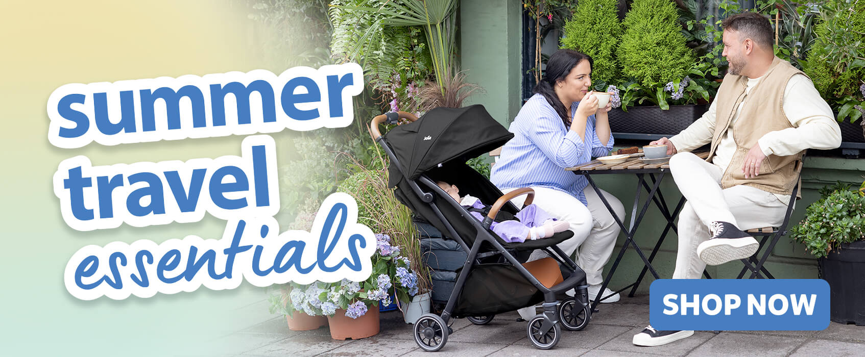 Parents chatting over coffee at a cafe table in an outdoor garden setting. Baby is relaxing comfortably next to them in the Joie pact pro pushchair. Text on the image is highlighting summer travel essentials.