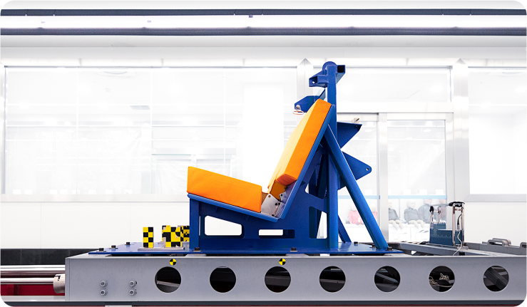 Side angle view of a car seat crash testing sled.
