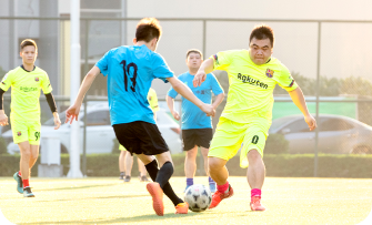 Joie employees playing soccer.