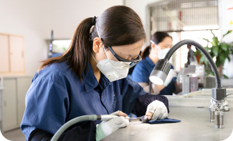 Laboratory associates performing tests.