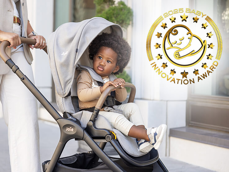 image of a child securely sitting in joie kava stroller in dove.