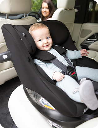 Joie i-Pivot 360 rear-facing car seat with smiling baby safely secured